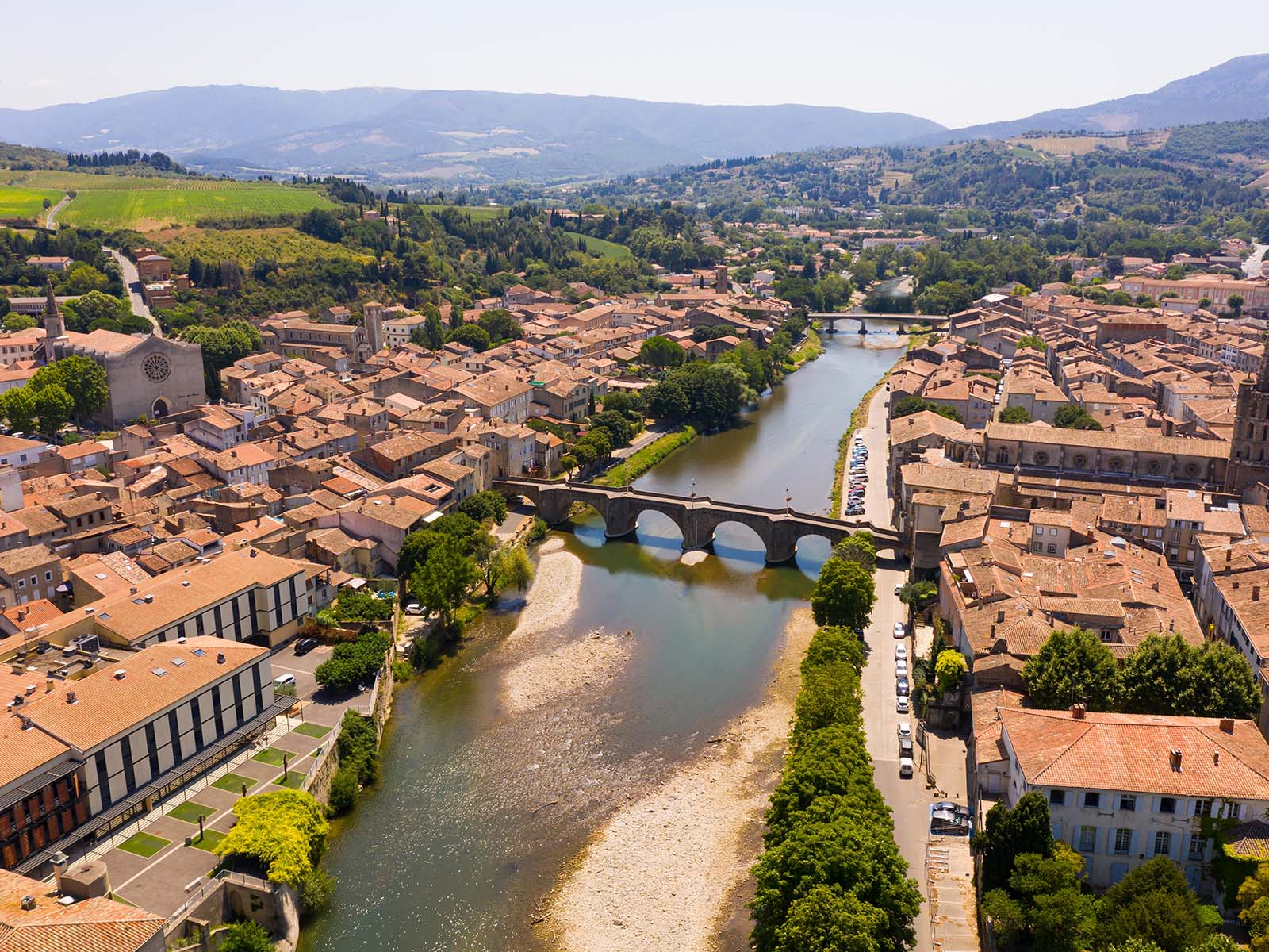 Aerial view of Limoux, the River Aude, its bridges, town centre and surrounding hills